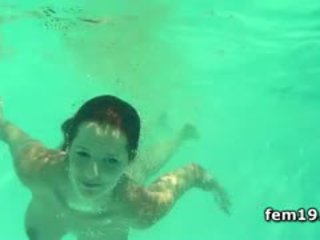 Redhead Ariel Cooling Her Pussy In The Pool